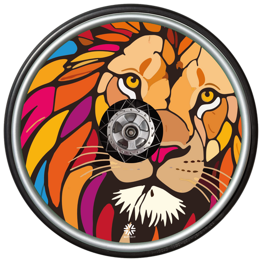Bright, bold lion head design on a wheelchair wheel with Niftikit logo.