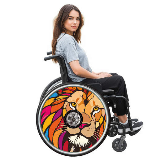Lady using a wheelchair with a colorful lion head and mane design on the wheel, on a white background