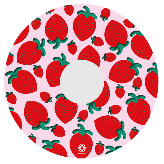 Wheel cover with strawberry pattern on a pink background. Small white Niftikit logo, centre cutout 