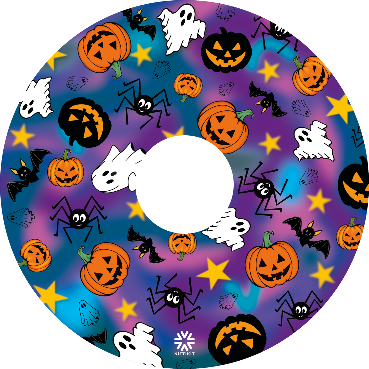 A wheelchair wheel cover or disc with centre cut out, featuring a colorful Halloween pattern with pumpkins, ghosts, bats, spiders, and stars on a purple and blue gradient background. 