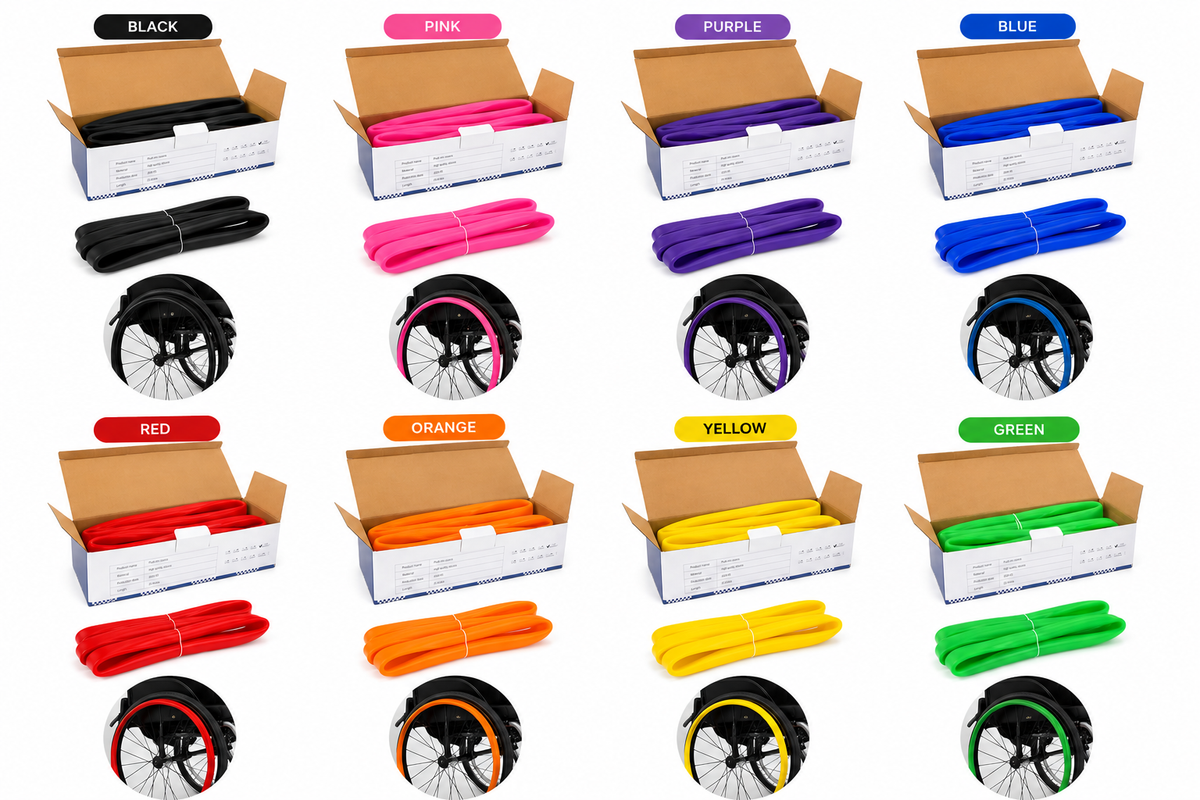Eight-colour range of silicone wheelchair push rim covers shown fitted to wheelchair wheels, including black, blue, green, orange, pink, purple, red and sunshine yellow handrim covers