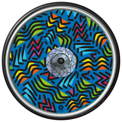 Wheelchair wheel with spoke guard featuring geometric lines of varying shapes and lengths on a blue background 