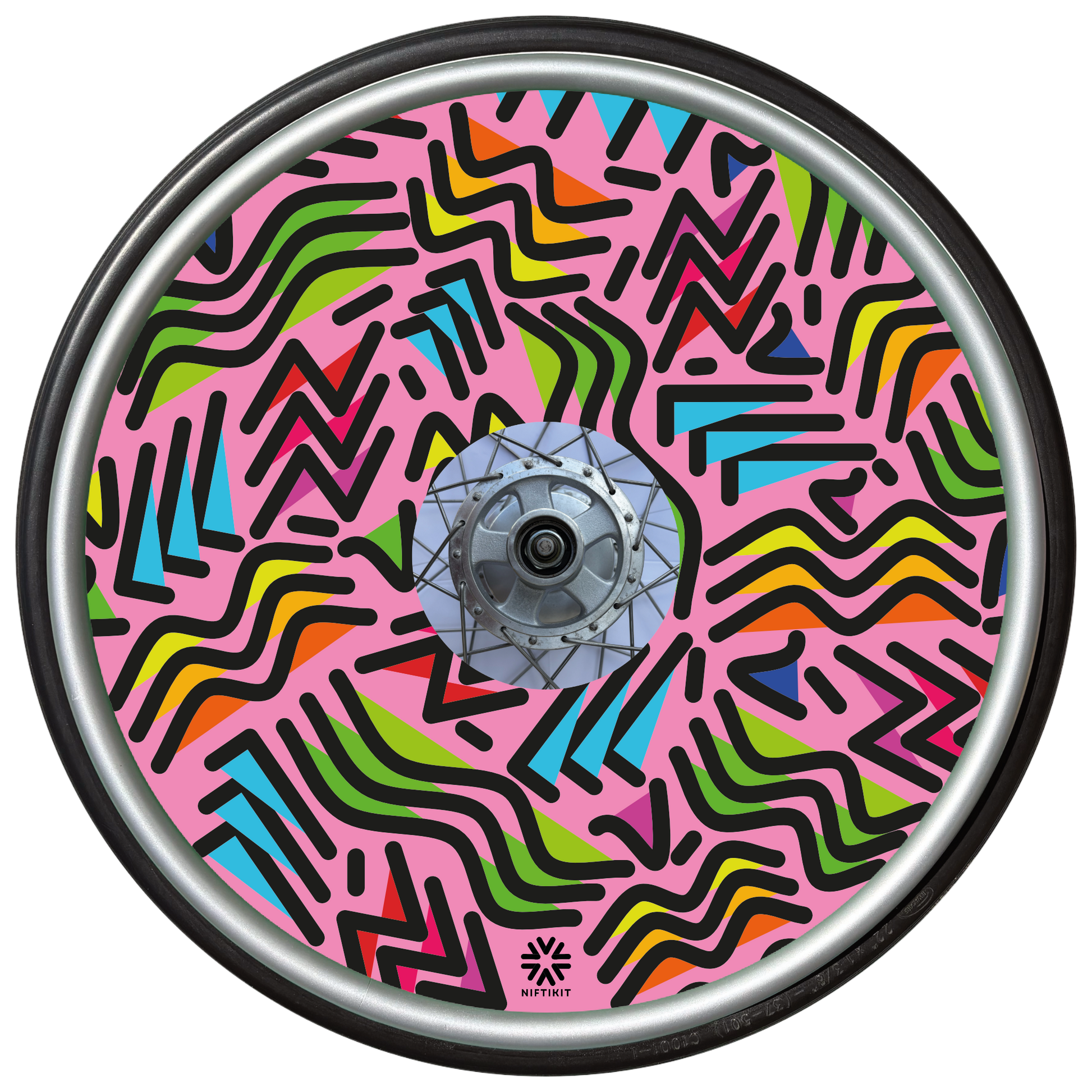 Wheelchair wheel with spoke guard featuring geometric lines of varying shapes and lengths on a pink background 