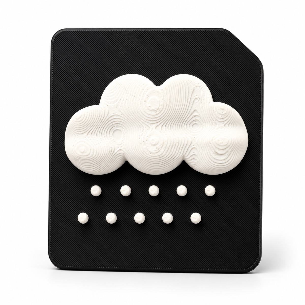 A 3D tactile hail weather symbol on black high contrast tile. Showing a raised cloud with hail for sensory learning, tactile discrimination for blind and visually impaired 