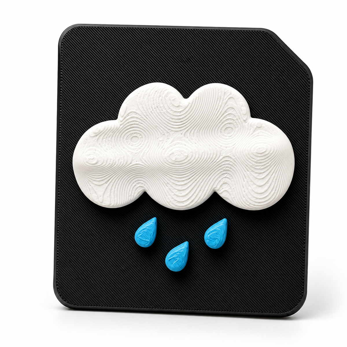 A 3D tactile rain weather symbol on black high contrast tile. Showing a raised cloud with rain for sensory learning, tactile discrimination for blind and visually impaired 