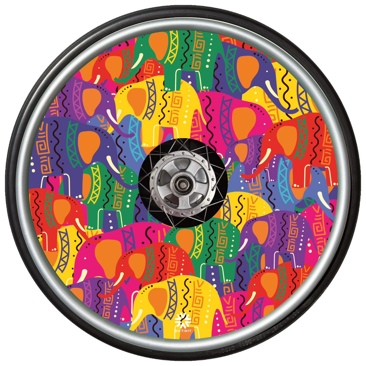 Pop Art Rainbow Elephant wheelchair wheel cover on a wheel with bright pink, yellow, orange, purple and green elephant pattern by Niftikit.